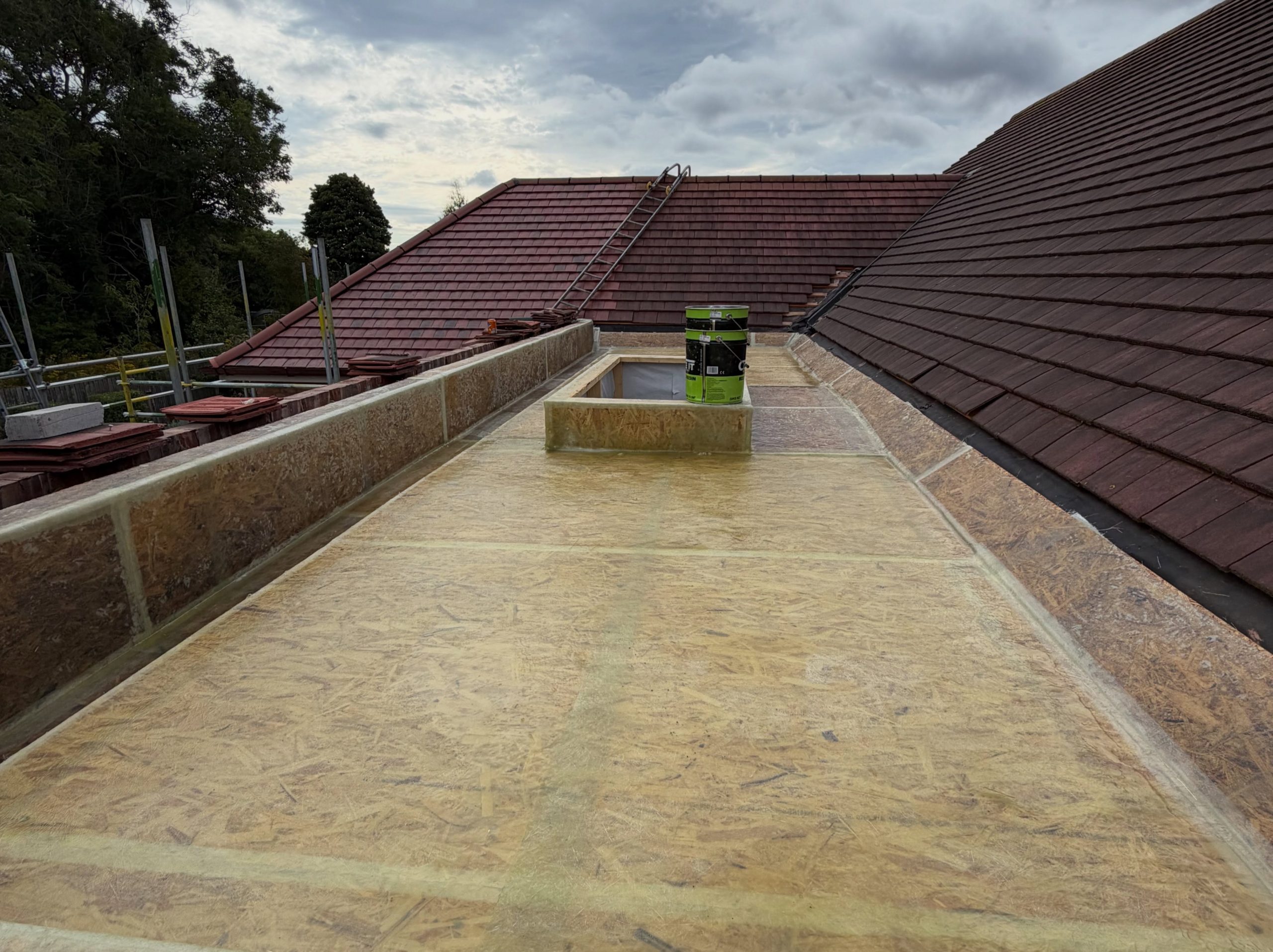 Flat roof deck and roof lantern upstand during extension construction Flat roof deck and roof lantern upstand during extension construction
