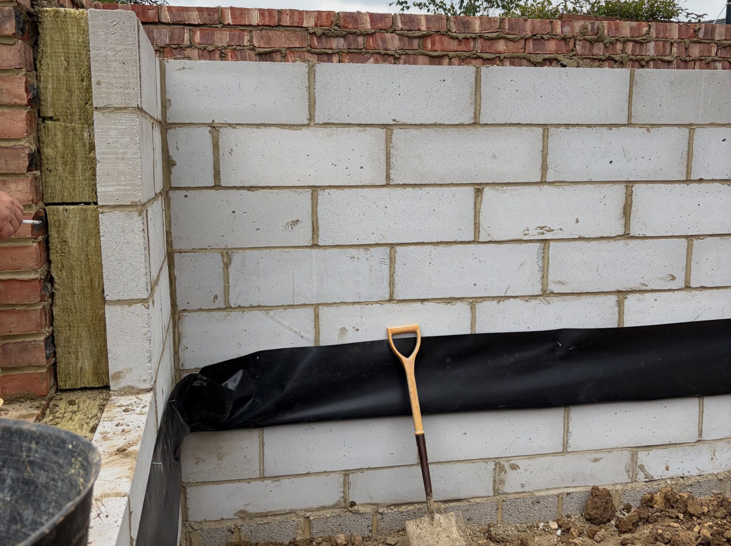 Blockwork and damp-proof membrane installed during extension construction Blockwork and damp-proof membrane installed during extension construction