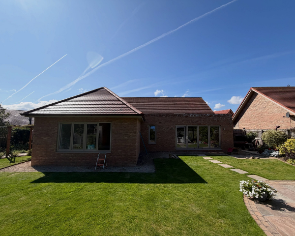 Completed Highgate Meadows house extension with hipped roof and landscaped garden in Hartlepool